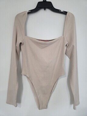 Atoir Neutral Ribbed Long Sleeve One-Piece Bodysuit in Beige